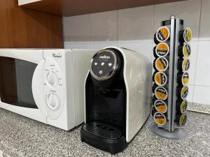 a toaster oven sitting on top of a kitchen counter at A Casa di Luca in Faenza