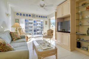a living room with a couch and a table at Palms 309 in Islamorada