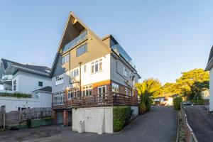 a large house is being built on a street at A Piece of Seaside Serenity on the Sandbanks Peninsula in Sandbanks