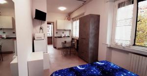 a kitchen with a refrigerator and a kitchen with a table at gattopastro in Milan