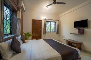 Ліжко або ліжка в номері Hotel Pasquina Baga