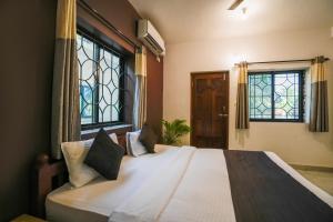 Ліжко або ліжка в номері Hotel Pasquina Baga