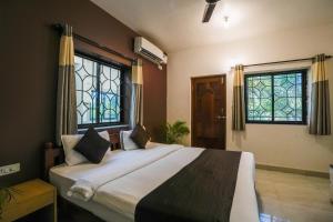Ліжко або ліжка в номері Hotel Pasquina Baga