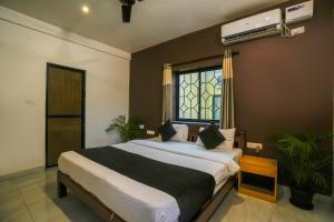 Ліжко або ліжка в номері Hotel Pasquina Baga