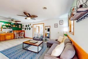 a living room with a couch and a table at The Cove - Main House in Golden