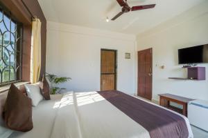 Ліжко або ліжка в номері Hotel Pasquina Baga