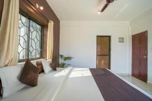 Ліжко або ліжка в номері Hotel Pasquina Baga