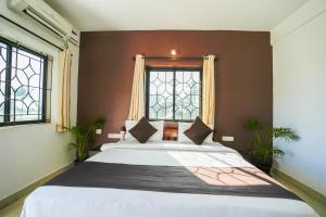 Ліжко або ліжка в номері Hotel Pasquina Baga