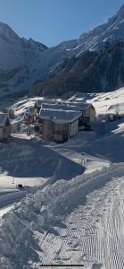 a ski lodge in the snow on a mountain at Chasa Larets in Samnaun