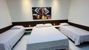 Postel nebo postele na pokoji v ubytování CHALES TEMATICOS