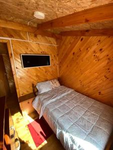 Ein Bett oder Betten in einem Zimmer der Unterkunft Cabañas León