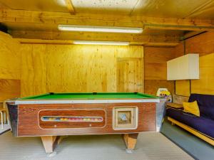a pool table in a room with a couch at 2 bed in Chulmleigh 87668 in Chulmleigh