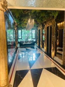 a lobby with a black and white tiled floor at luxury stay Monaco in Na Jomtien