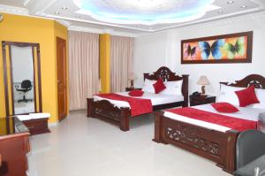 Giường trong phòng chung tại Hotel Vans Valledupar