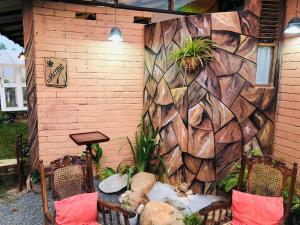 a wall with plants on it next to a building at Samara Nature Paradise in Kalutara