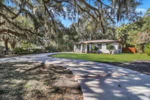 a driveway with a house in the background at Luxury Savannah Retreat Heated Pool and Pet Friendly in Savannah