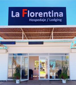 a building with a sign for la florentina hospitable lagging at Hospedaje la Florentina in Pica