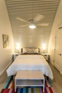 a bedroom with a white bed and a ceiling at Moon 201 - Crescent Moonset Suite - 1BR - 1 Bath in New Orleans