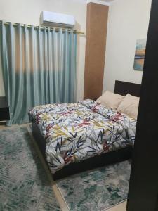 Ένα ή περισσότερα κρεβάτια σε δωμάτιο στο Abeer suites 2