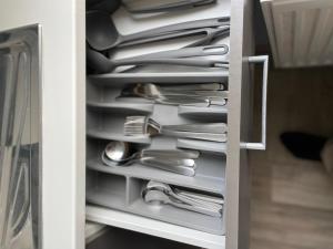 a drawer filled with silver utensils at 60m² Wohnung in Krefeld Zentrum, nähe Düsseldorf Hbf, Messe, Zentrum in Krefeld