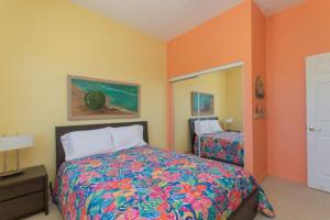 a bedroom with a bed and a mirror at Pelican Landing in Islamorada