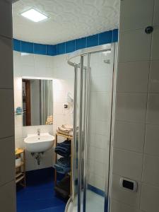 a bathroom with a sink and a shower at Casa vacanze Maison Zio Bruno A' Scalinatella in Naples
