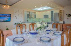 a dining room table with blue and white dishes on it at Apple home Detached house in sunny Ierapetra in Ierapetra
