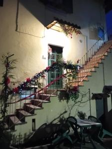 a staircase in a building with flowers on it at Marianna casa vacanza in Azzate