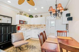 a kitchen with a dining room table and chairs at Sunrise haven in Clearwater Beach