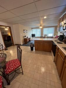 a large kitchen with a table and chairs in it at Spacious Apt near Guthrie Packer in Sayre