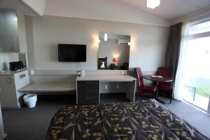 TV a/nebo společenská místnost v ubytování Hotel Ashburton