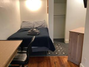 a bedroom with a bed and a table and a desk at Spacious Inviting Home by BU UHS & Guthrie in Johnson City