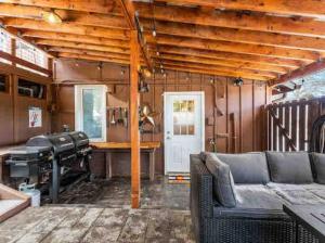 a living room with a couch and a table at HOT TUB Firepit Sauna Peak to Peak Loft Retreat in Nederland