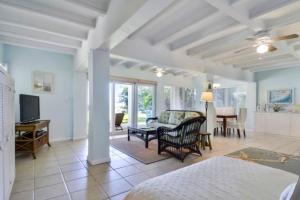 a living room with a couch and a table at Sunshine Place in Islamorada