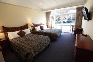 Postel nebo postele na pokoji v ubytování Hotel Ashburton