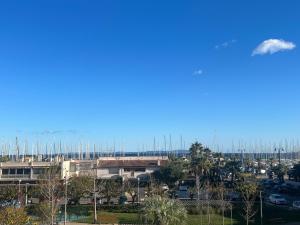 a view of a parking lot with sailboats at Cap Porquerolles in Hyères