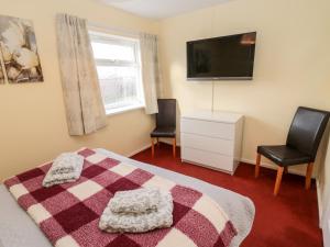 En eller flere senge i et værelse på Cheviot View