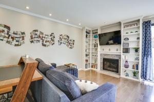 a living room with a couch and a fireplace at Downtown San Diego Condo in Marina District! in San Diego