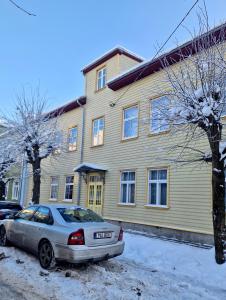 a car parked in front of a house at Tolstoi Scandinavian 1 bedroom apartment + free parking in Tartu