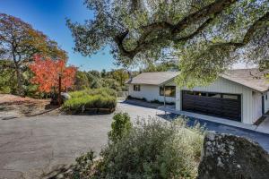 a house with a garage and a driveway at Mountain Home Near Yosemite with Well-Being Retreat! in Ahwahnee