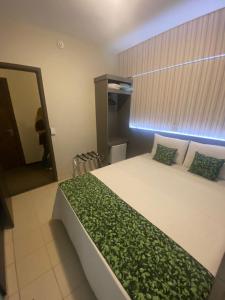 A bed or beds in a room at EKO HOTEL