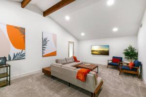 a living room with a couch and two chairs at Mid-Century-Modern Airport Home in Sacramento