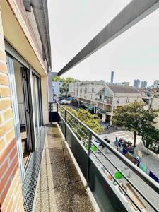 a balcony of a building with a view of a street at Magnificent apartment Paris Bagnolet 302 in Bagnolet