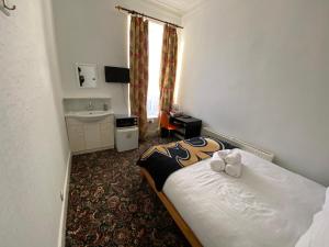 Postel nebo postele na pokoji v ubytování Aaran Central Guesthouse