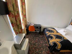 Postel nebo postele na pokoji v ubytování Aaran Central Guesthouse
