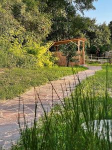 a wooden pavilion in the middle of a field at Schönhof im Weinviertel in Hadres