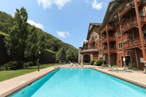 a large swimming pool in front of a building at Hunter Mtn Slopeside Ski Resort HotTub*Heated Pool in Hunter