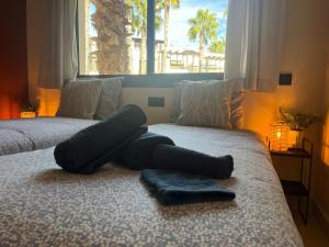 a pair of beds in a room with a window at Casa André - 3 Bedroom Roda Golf apartment nearby entrance and clubhouse in Roda