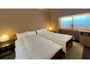 Krevet ili kreveti u jedinici u okviru objekta Obama Onsen Ryokan Kunisaki - Vacation STAY 98457v