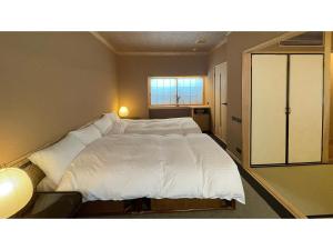 Cama o camas de una habitación en Obama Onsen Ryokan Kunisaki - Vacation STAY 98457v
